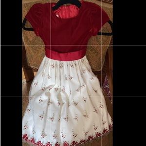 red velvet dress with bow on back and rose designs